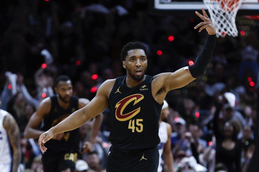 Cleveland Cavaliers guard Donovan Mitchell celebrates after making a three point basket against the Orlando Magic during the second half of Game 5 of an NBA basketball first-round playoff series, Tuesday, April 30, 2024, in Cleveland. (AP Photo/Ron Schwane)