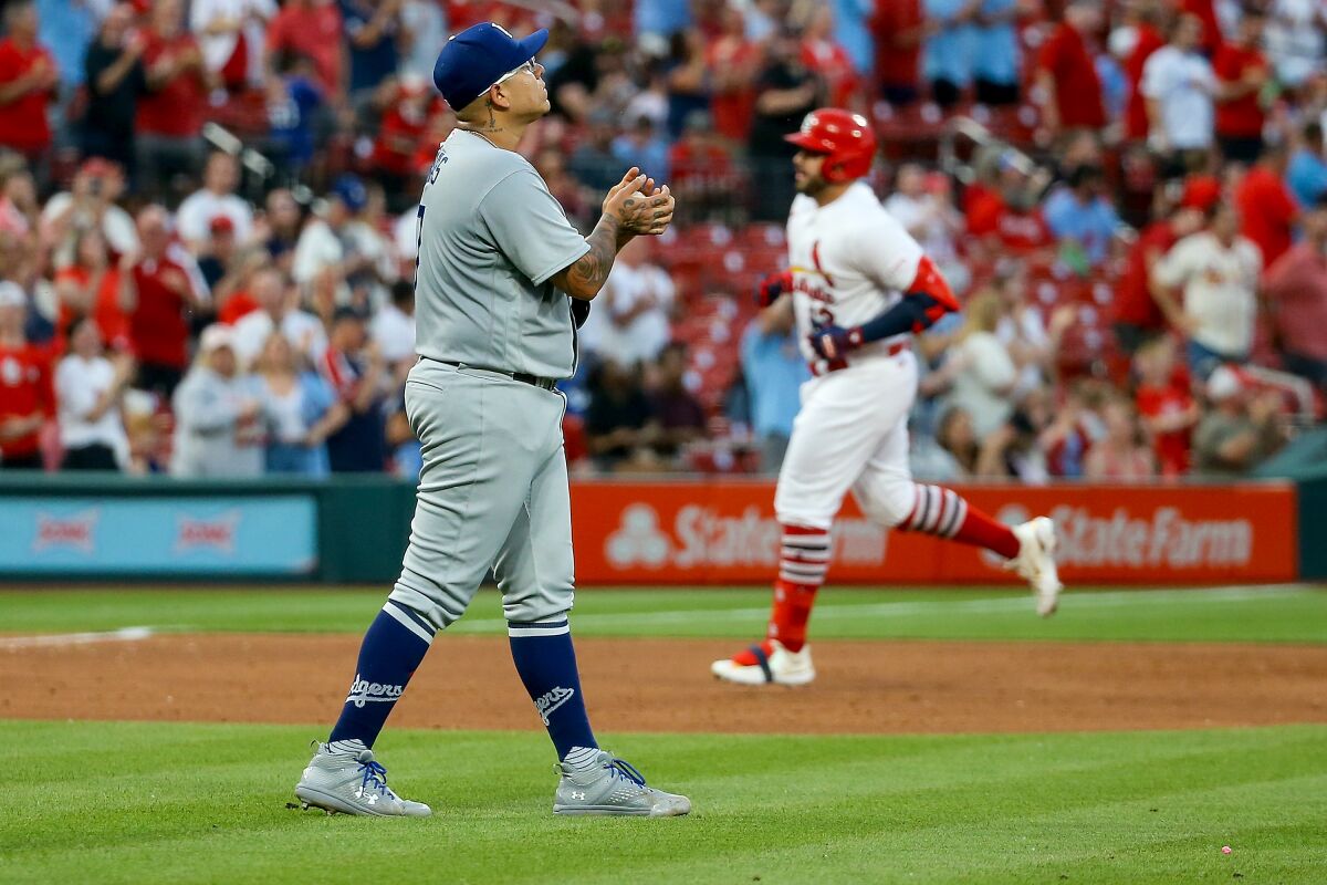 Dodgers pitcher Julio Urías walks back to the mound after giving up a solo home run to Juan Yepez.