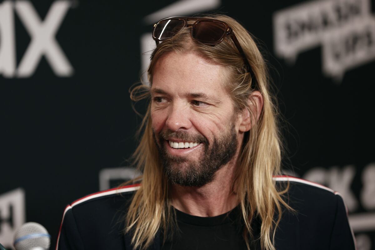 A man with long blond hair and a beard 