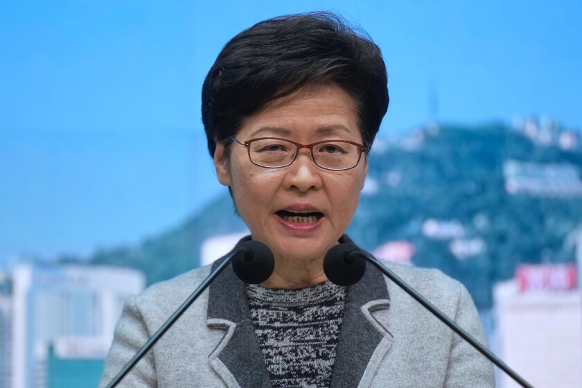 Hong Kong Chief Executive Carrie Lam speaks during a press conference in Hong Kong, Thursday, Jan. 6, 2022. Lam said Thursday she was disappointed that nine government officials attended a large birthday party that has sparked fears of a new omicron cluster after a guest tested positive for the coronavirus. (AP Photo/Vincent Yu)
