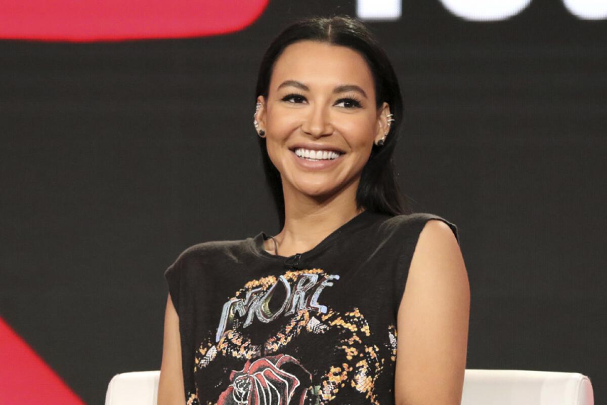 Naya Rivera smiling in a black shirt