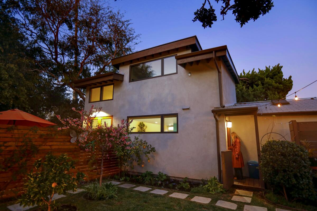 A two-story ADU with raised windows to maximize privacy and light.