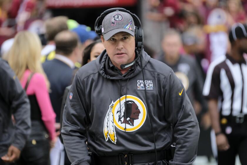 Washington Redskins head coach Jay Gruden walks to the bench prior to an NFL football game against the New England Patriots, Sunday, Oct. 6, 2019, in Landover, Md. (AP Photo/Mark Tenally)