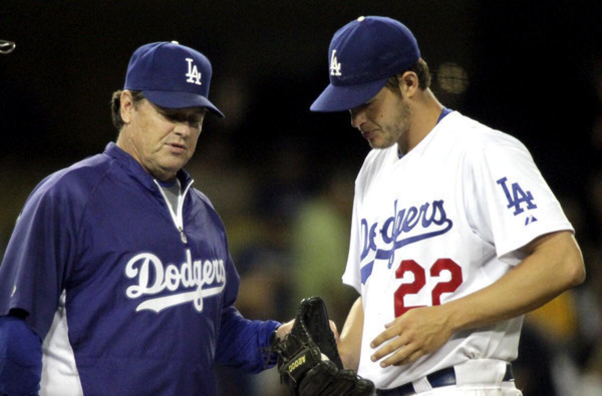 Dodgers pitching coach Rick Honeycutt chats with ace Clayton Kershaw.