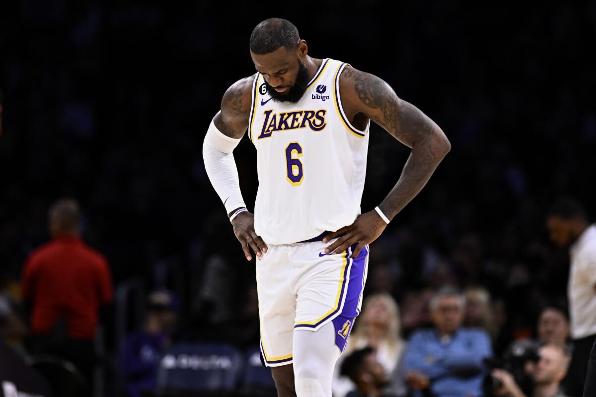Los Angeles Lakers forward LeBron James walks off the court during a timeout during the first half.