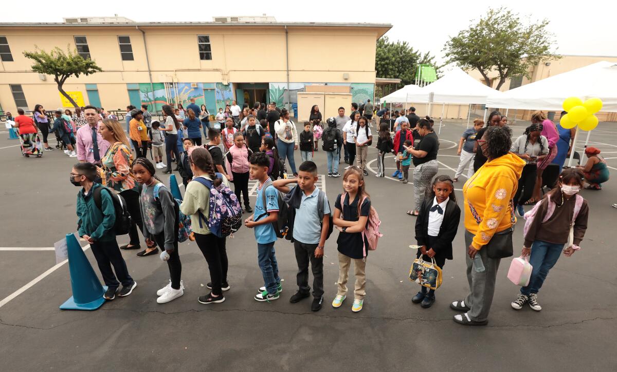 Students line up for class at a school in L.A. County.