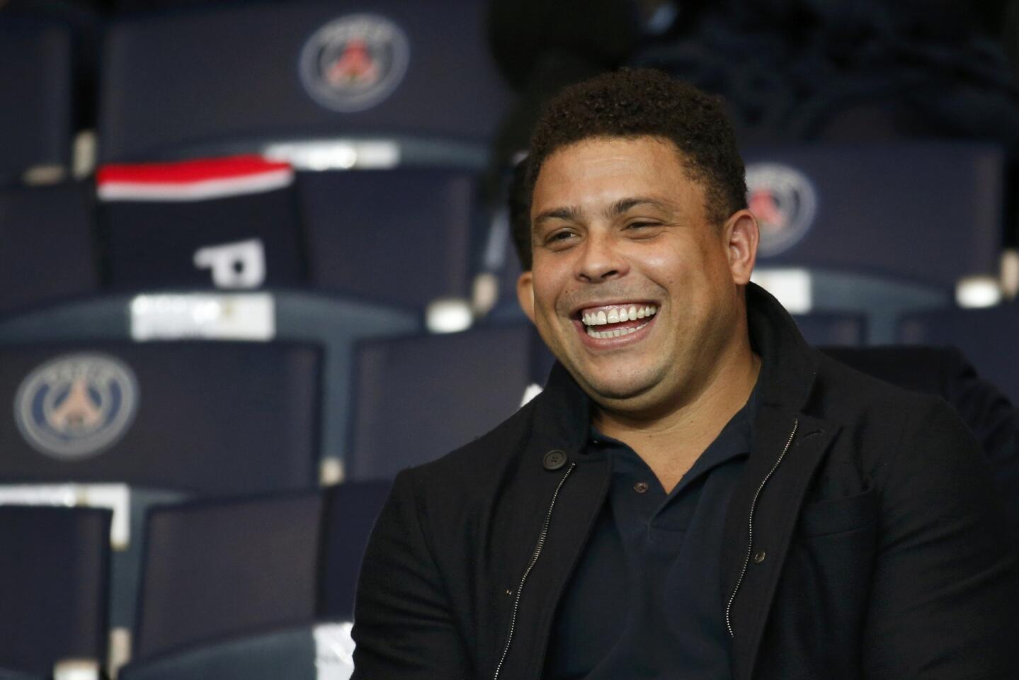 Former soccer player Ronaldo of Brazil attends the Champions League Group A soccer match where Paris Saint Germain face Real Madrid at the Parc des Princes stadium in Paris
