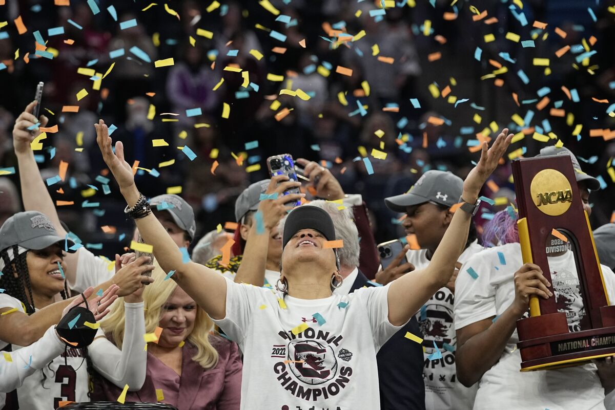 FILE - South Carolina head coach Dawn Staley celebrates after a college basketball game in the final round of the Women's Final Four NCAA tournament against UConn Sunday, April 3, 2022, in Minneapolis. South Carolina won 64-49 to win the championship. (AP Photo/Eric Gay, File)