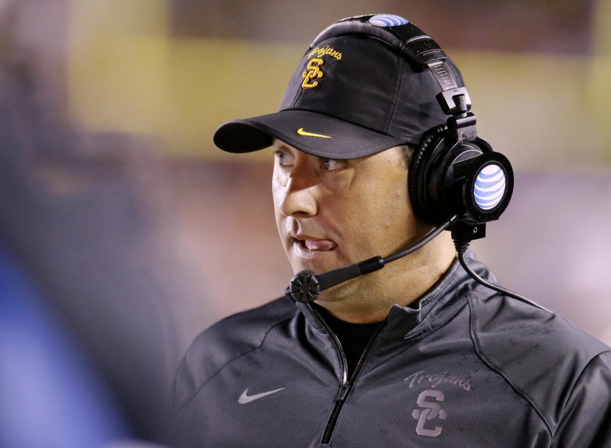 USC Coach Steve Sarkisian watches his offense take an early lead Saturday against Boston College. Things went downhill from there in a 37-31 loss.