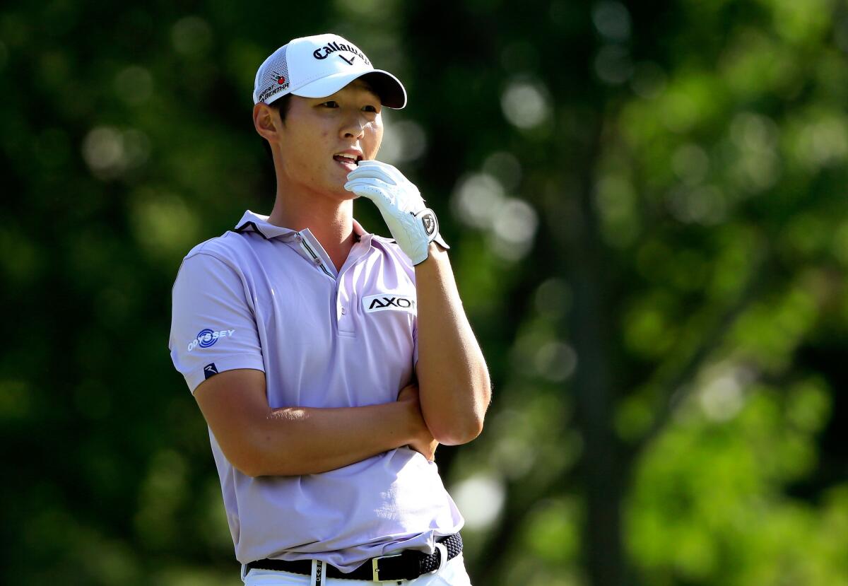 Danny Lee looks on from the ninth tee during the first round of the World Golf Championships - Bridgestone Invitational.