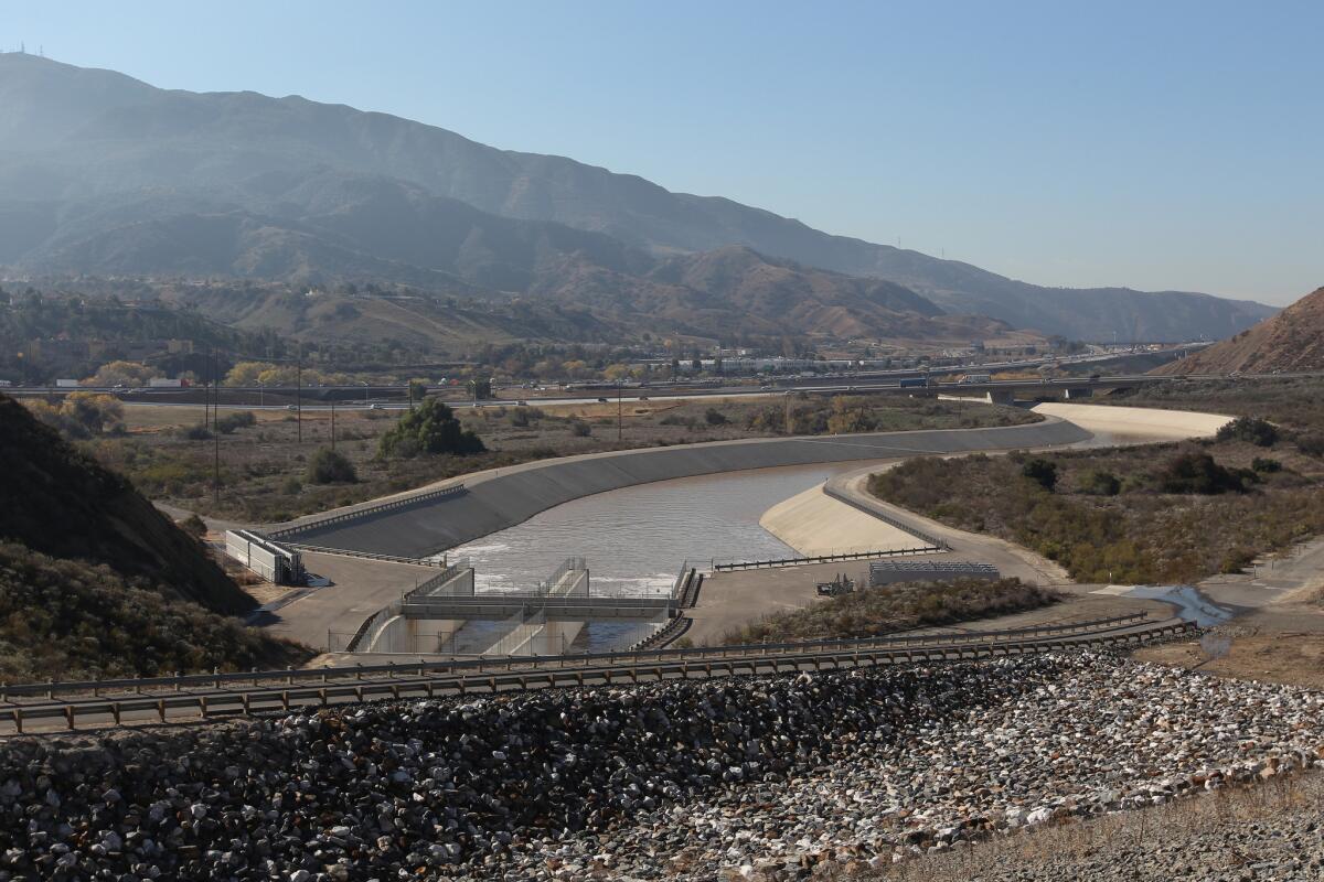 Water from January storms flows down the Santa Ana River channel from Prado Dam. OnthePublicRecord.org follows the ins and outs of California water policy.