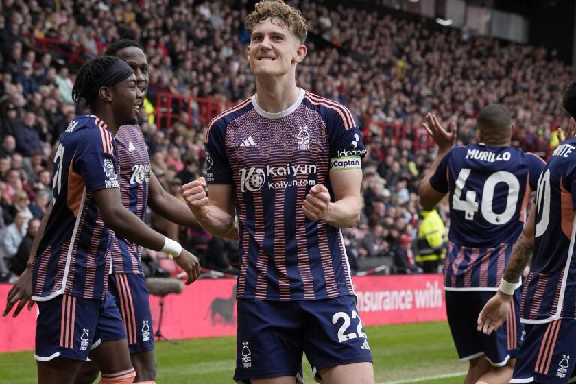 Nottingham Forest's Ryan Yates, centre, celebrates after scoring his sides second goal of the game, during the English Premier League soccer match between Sheffield United and Nottingham Forest, at Bramall Lane, in Sheffield, England, Saturday May 4, 2024. (Danny Lawson/PA via AP)