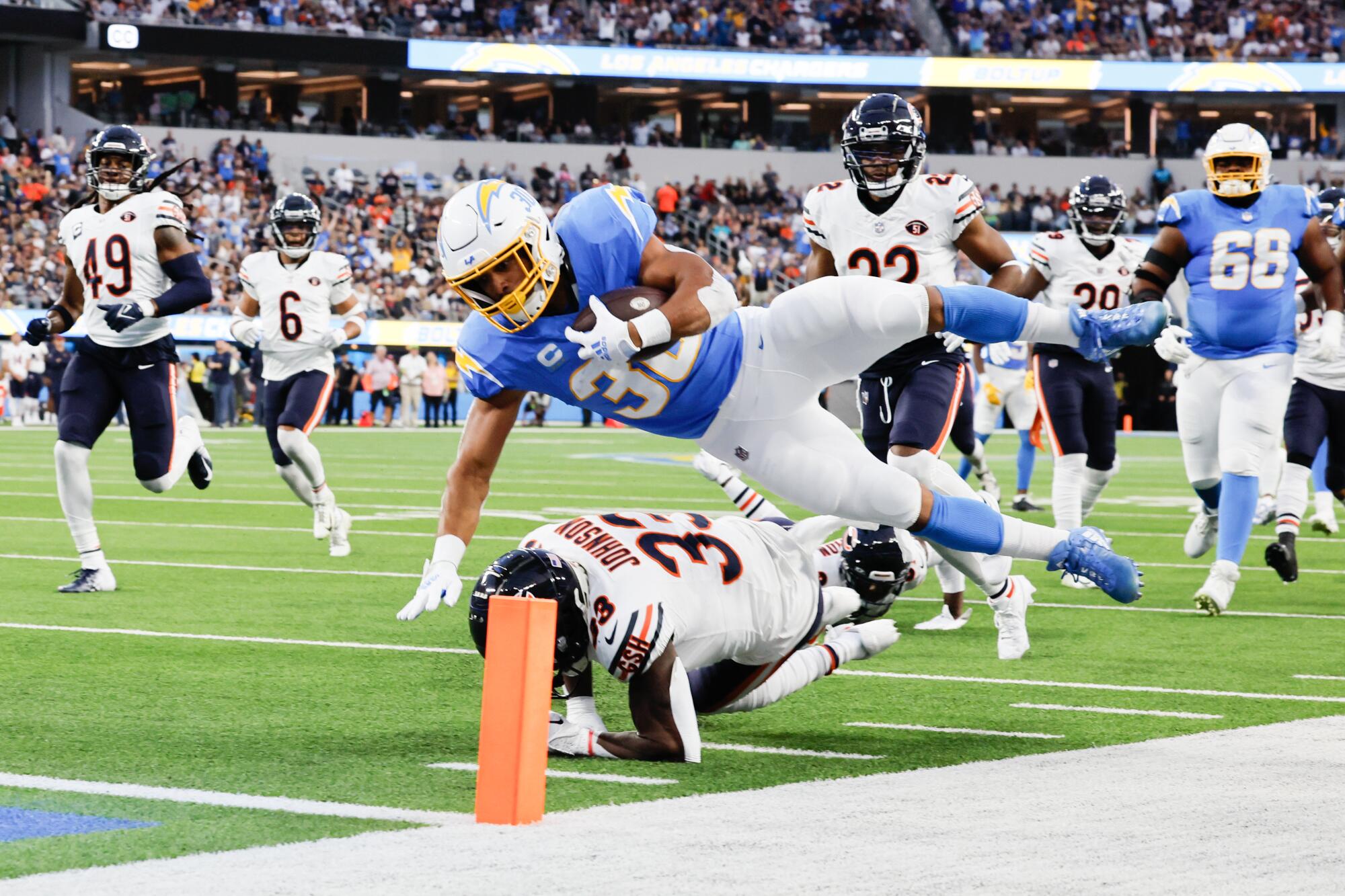 Chargers running back Austin Ekeler dives into the end zone on a 39-yard catch-and-run against the Chicago Bears.