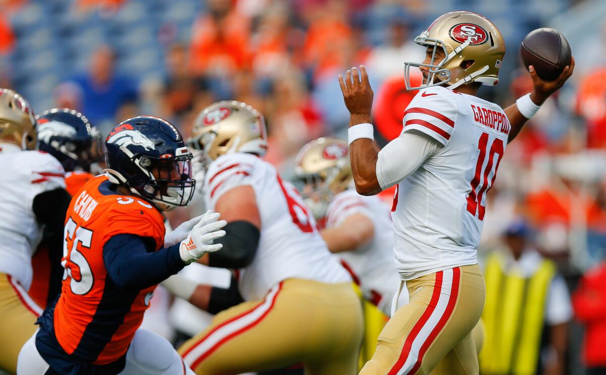 San Francisco 49ers quarterback Jimmy Garoppolo prepares to throw an interception under pressure from Broncos linebacker Bradley Chubb during a preseason game Monday in Denver.