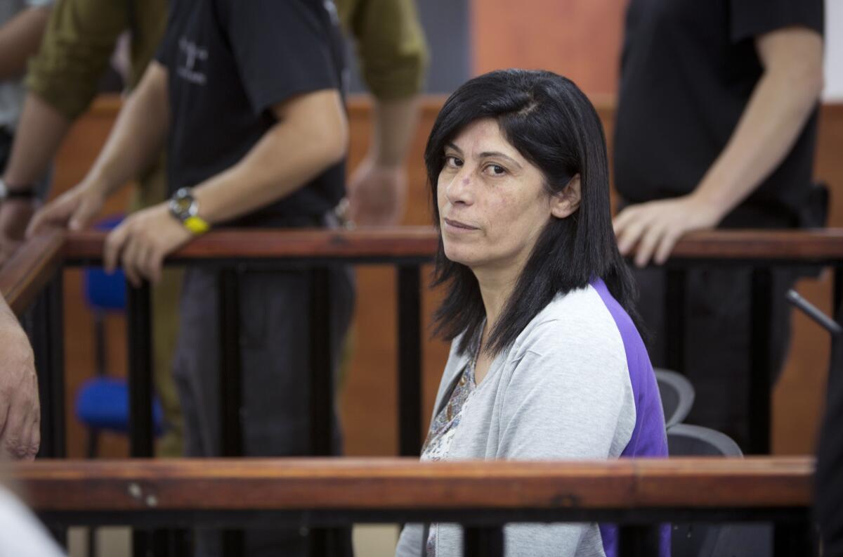 FILE - This May 21, 2015 file photo shows Palestinian Parliament member Khalida Jarrar of the Popular Front for the Liberation of Palestine (PFLP) attending a court session at the Israeli Ofer military base near the West Bank city of Ramallah. An Israeli military court has sentenced Jarrar, Tuesday, March 2, 2021, to two years in prison in a plea bargain that convicted her of belonging to an outlawed group but dropped the most serious charges against her. (AP Photo/Majdi Mohammed, File)