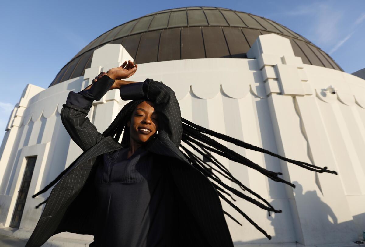 Sudan Archives gets into character as she visits the Griffith Park Observatory on Aug. 24. Sudan is a rising musical sensation, a violinist and singer who mixes R&B and hip-hop with West Africa and Sudanese rhythms.