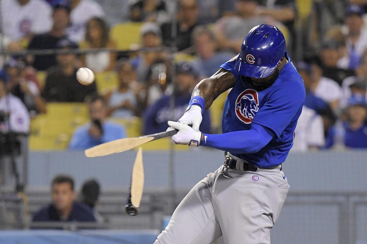 Chicago's Jason Heyward hits a broken-bat single in the fifth inning against the Dodgers.