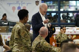 U.S. President Joe Biden eats ice cream as Biden meets with American service members and their family at Osan Air Base, Sunday, May 22, 2022, in Pyeongtaek, South Korea. (AP Photo/Evan Vucci)