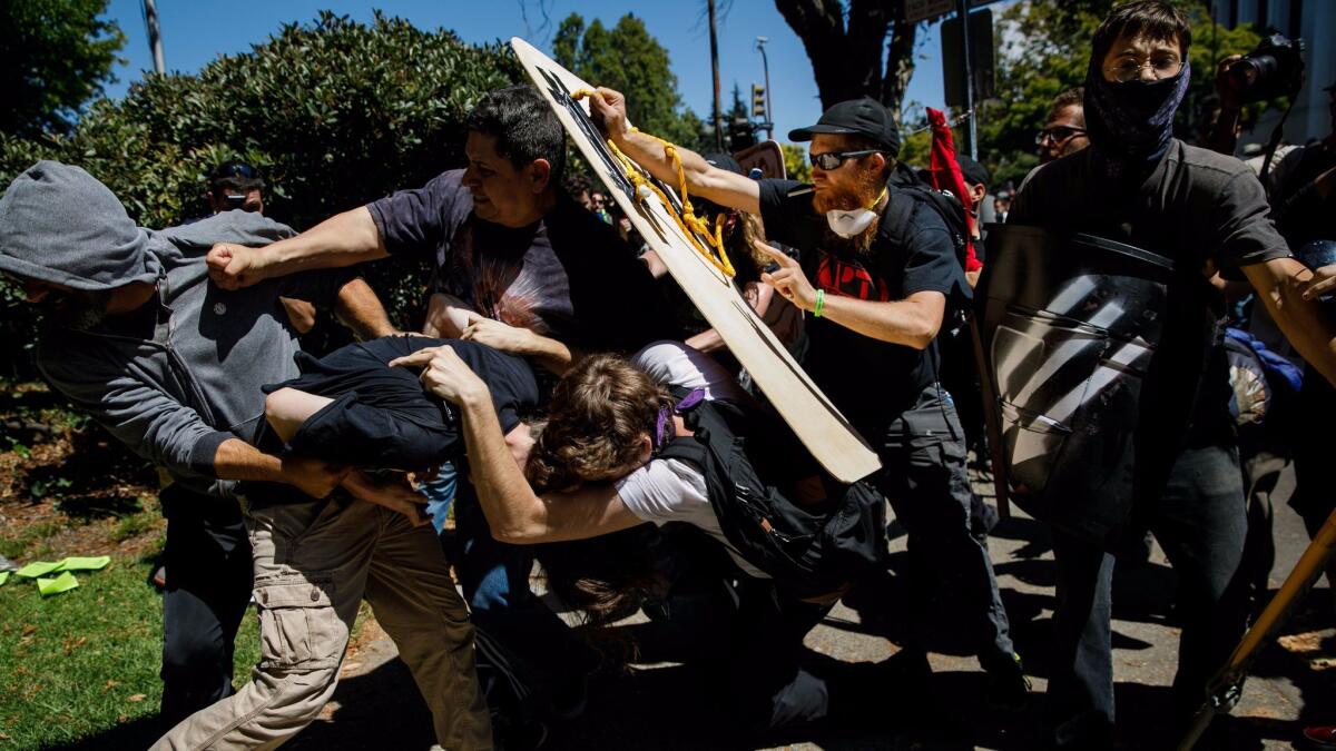 Los Angeles may ban pepper spray, Tasers and improvised shields from protests after violent demonstrations like this one in Berkeley and other cities across the country.