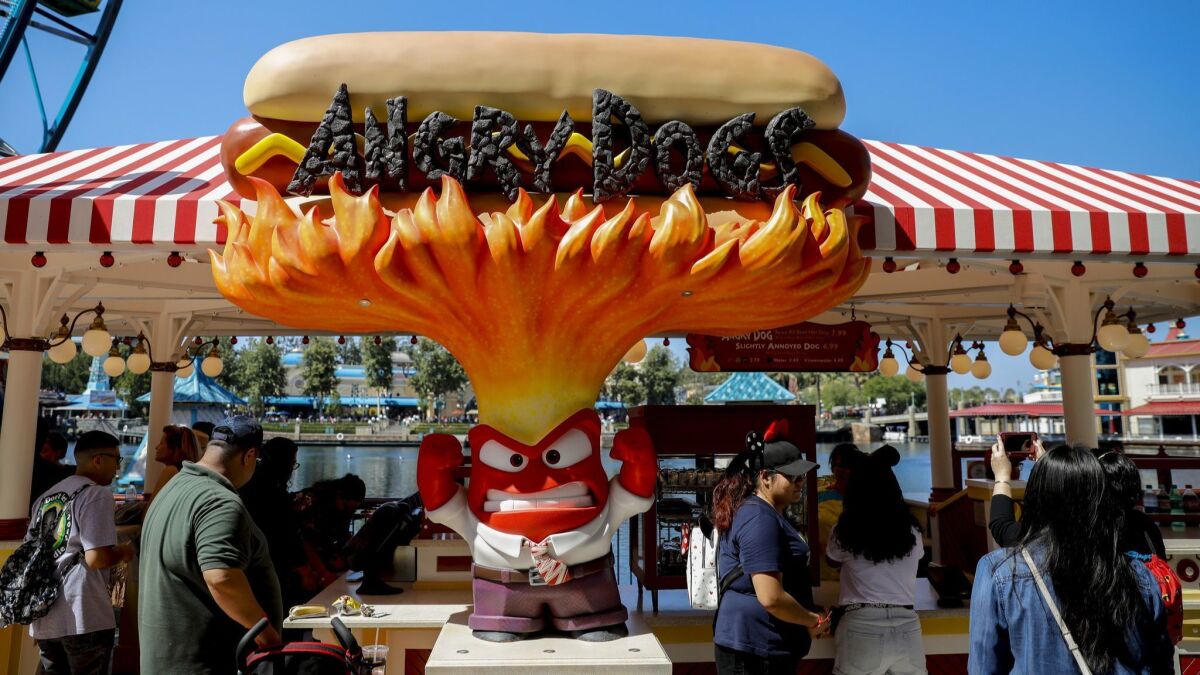 The hot dog stand at Pixar Pier is themed to "Inside Out."