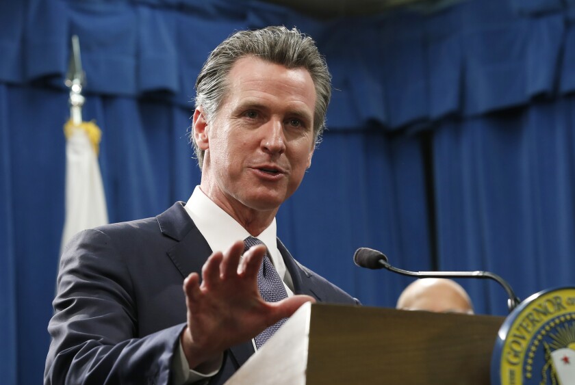 California Gov. Gavin Newsom responds to a reporter's question about his executive order advising that non-essential gatherings of more than 250 people should be canceled until at least the end of March, during a news conference in Sacramento on March 12, 2020. (AP Photo/Rich Pedroncelli)
