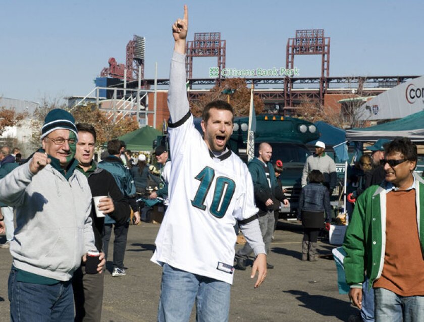Bradley Cooper, center, plays Pat Solatano, a fierce Philadelphia Eagles fan, in the movie "Silver Linings Playbook."