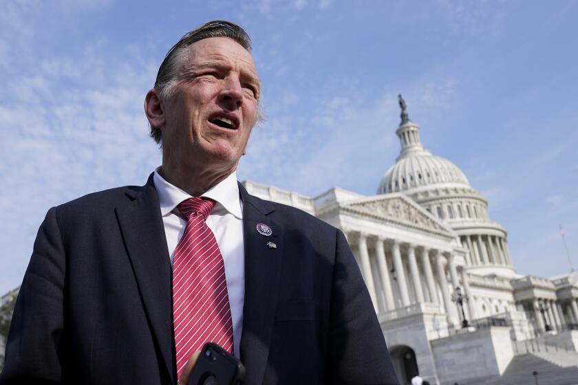 FILE - Rep. Paul Gosar, R-Ariz., waits for a news conference about the Delta variant of COVID-19 and the origin of the virus, at the Capitol in Washington, Thursday, July 22, 2021. Gosar is facing criticism after he tweeted a video that included altered animation showing him striking congresswoman Alexandria Ocasio-Cortez with a sword. In a tweet Monday night, Ocasio-Cortez said Gosar “shared a fantasy video of him killing me.” (AP Photo/J. Scott Applewhite, File)