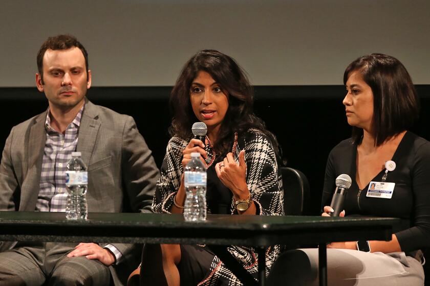 Panelists Sina Safahieh, Prerna Rao, and Valeri Trezise of the ASPIRE group, from left, answer audience questions during the Hoag and CUSD Speaker Series: "Gaming, Social Media and Mental Wellness" discussion at Capistrano High School on Wednesday. The event is intended to help teens and families navigate mental health issues as it pertains to gaming, social media issues.