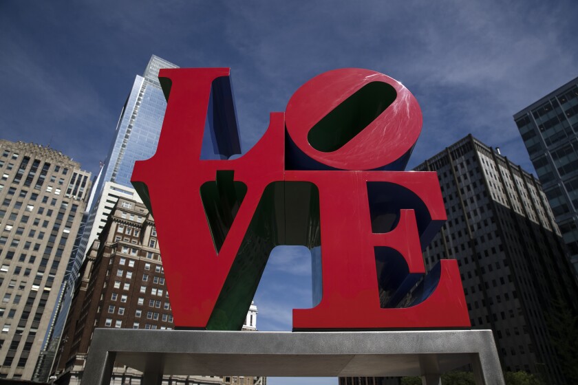 FILE — The Robert Indiana sculpture "LOVE" stands in John F. Kennedy Plaza, commonly known as Love Park, in Philadelphia, Monday, May 21, 2018. Maine Attorney General Aaron Frey has resolved claims against the estate of the late artist Robert Indiana and several law firms accused of excessive legal fees, officials said Monday, Jan 24, 2022. (AP Photo/Matt Rourke, File)