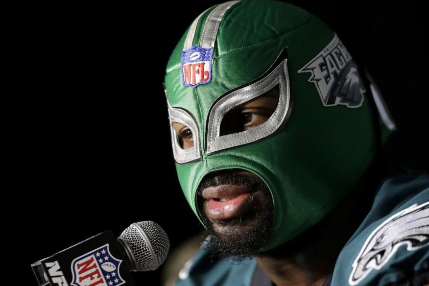 Philadelphia Eagles defensive tackle Fletcher Cox wears a wrestling mask as he takes part in a media availability for the NFL Super Bowl 52 football game Wednesday, Jan. 31, 2018, in Minneapolis. Philadelphia is scheduled to face the New England Patriots Sunday. (AP Photo/Eric Gay)