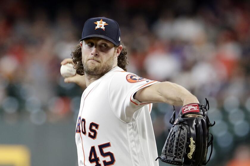 Houston Astros starting pitcher Gerrit Cole (45) throws during the first inning of a baseball game against the Colorado Rockies Wednesday, August 7, 2019, in Houston. (AP Photo/Michael Wyke)
