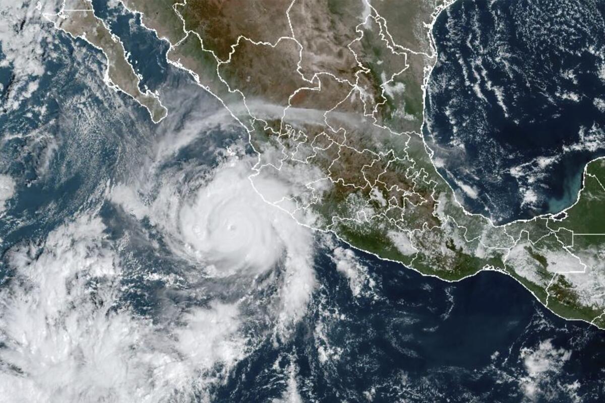 This satellite image taken at 15:30 UTC and provided by NOAA shows Tropical Storm Roslyn approaching the Pacific coast of Mexico, Saturday, Oct. 22, 2022. Roslyn grew to Category 4 force on Saturday as it headed for a collision with Mexico’s Pacific coast, likely north of the resort of Puerto Vallarta. (NOAA via AP)