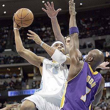 ATTENTION K-MART STOPPERS: Denver's Kenyon Martin goes up against Lamar Odom and Chris Mihm, behind.