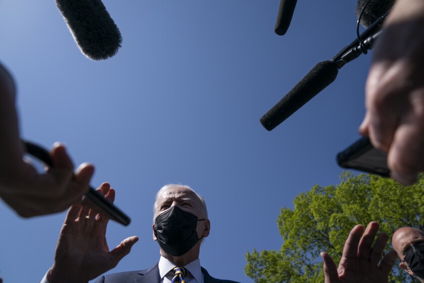 President Joe Biden talks with reporters on the Ellipse on the National Mall after spending the weekend at Camp David, Monday, April 5, 2021, in Washington. (AP Photo/Evan Vucci)