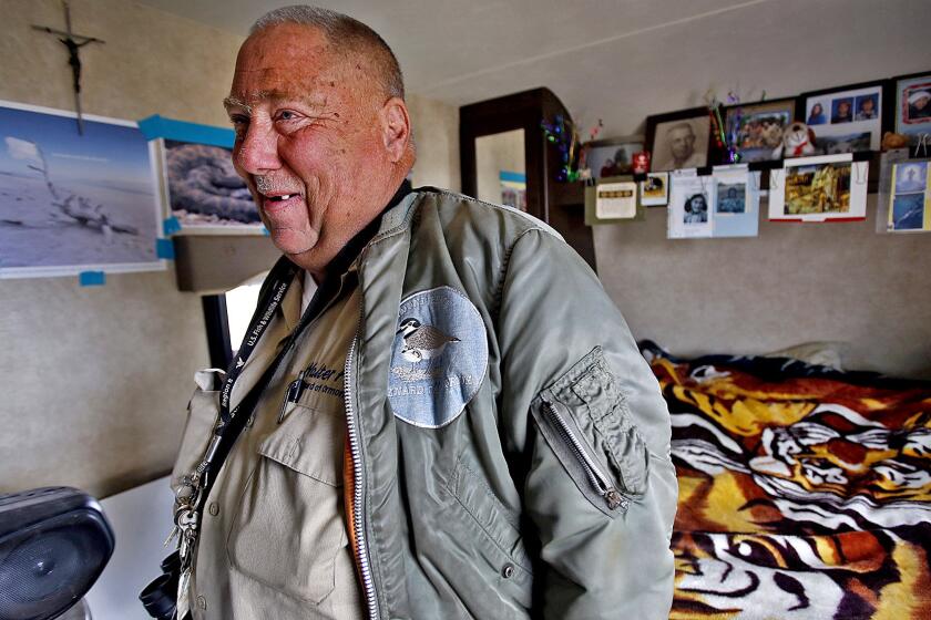 Walter Fuller inside his modest trailer. He has been working for 17 years to preserve Ormond Beach Wetlands in Oxnard.
