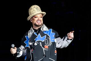 Boy George of Culture Club performs in concert during "The Letting It Go Show." 