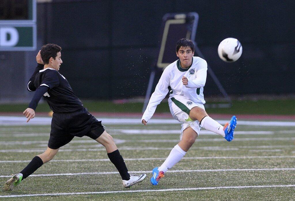 Sage Hill School's Gabriel Gamboa, right, clears the ball against Brethren Christian's Ryan Assaf, left, during the first half in an Academy League game on Thursday.