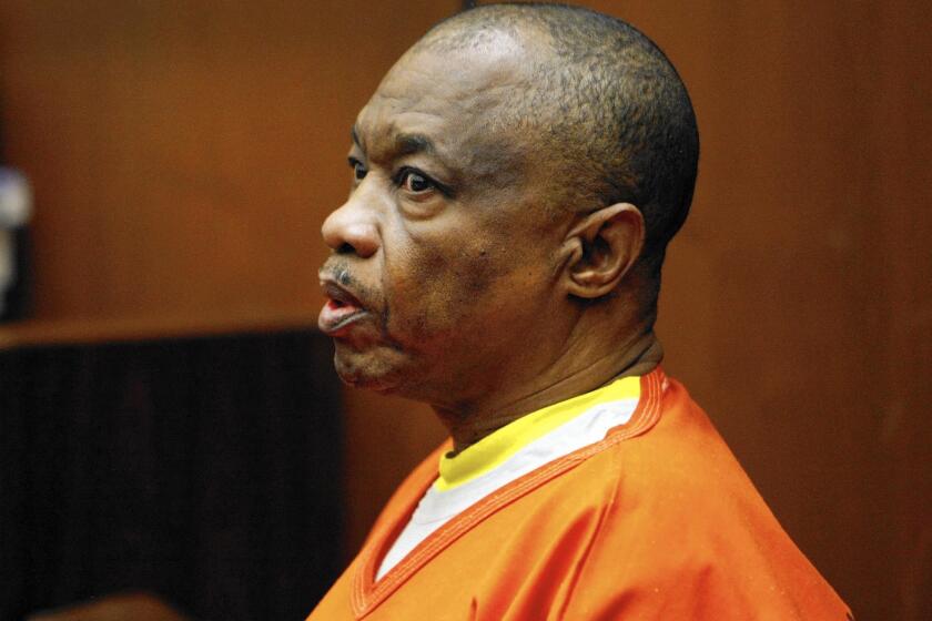 Lonnie Franklin Jr., who authorities say is the Grim Sleeper serial killer, answers questions from the witness stand in January 2014. His trial, which has been repeatedly postponed, is set to start in October.