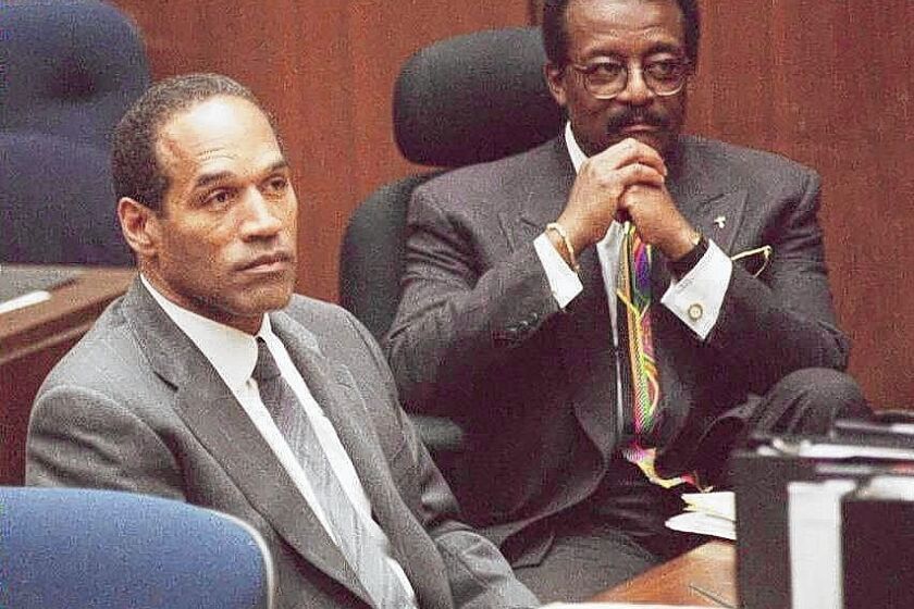O.J. Simpson, left, and his attorney Johnnie Cochran Jr. during the trial.