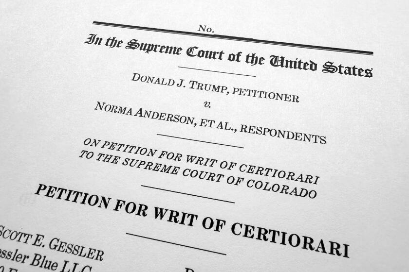 A page from the appeal by former President Donald Trump asking the U.S. Supreme Court to review the Colorado Supreme Court's finding that an insurrection clause in the Constitution's 14th Amendment renders Trump ineligible to be on the state's ballot over his role in the Jan. 6, 2021, U.S. Capitol attack, is photographed Wednesday, Jan. 3, 2024. (AP Photo/Jon Elswick)