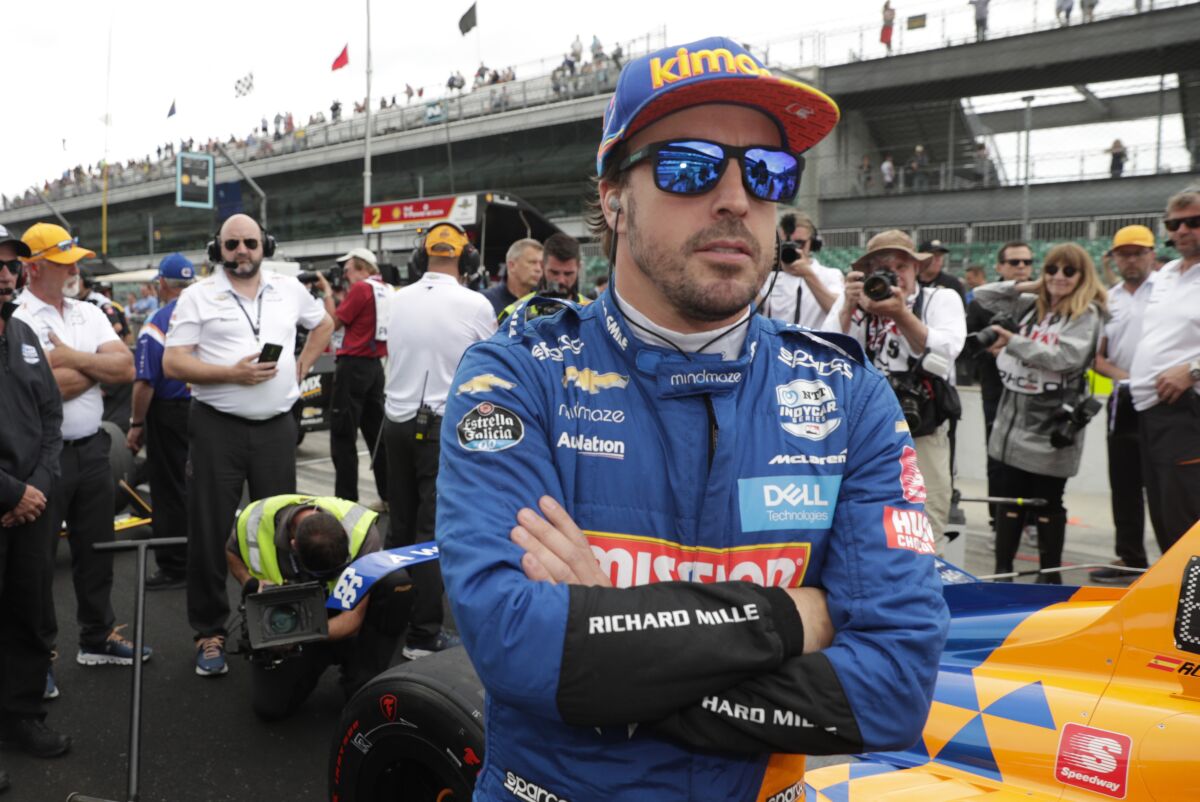 FILE - In this file photo dated Sunday, May 19, 2019, Fernando Alonso, of Spain, prepares to drive during qualifications for the Indianapolis 500 IndyCar auto race at Indianapolis Motor Speedway, in Indianapolis, Ind. Fernando Alonso feels far better about his chances to close out motorsports' version of the Triple Crown in 2020. The Spaniard will race for Arrow McLaren SP in the Indianapolis 500 in May and believes the organization is prepared. (AP Photo/Michael Conroy, File)
