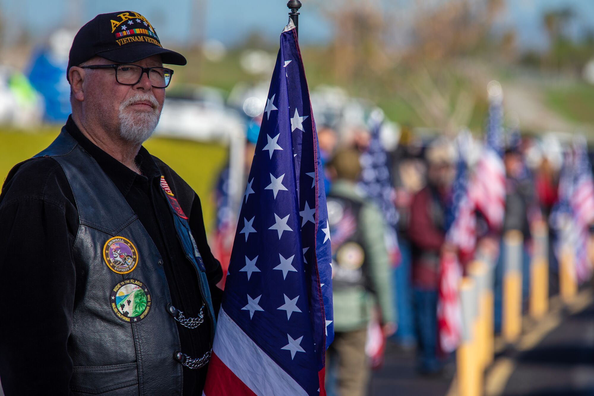 Billy Morgan stands in respect for the motorcade escorting fallen Riverside County Sheriff's deputy Isaiah Cordero