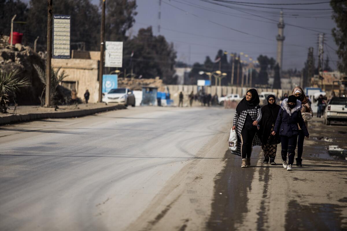 People return to Hassakeh, Syria, on Sunday after intense fighting.