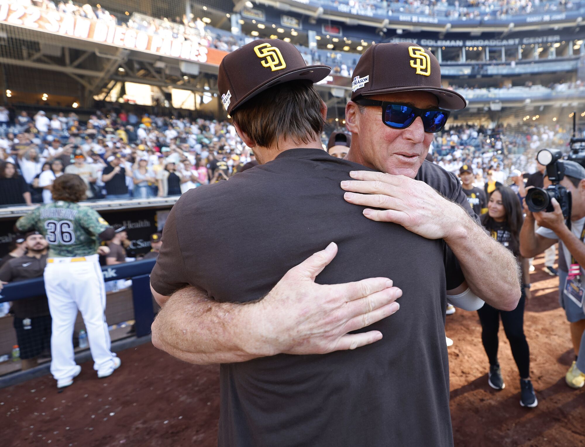 Padres manager Bob Melvin hugs Wil Myers after Sunday's game.