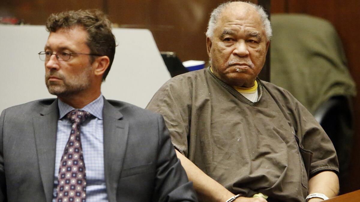 LOS ANGELES, CA SEPTEMBER 25, 2014 - Convicted serial killer Samuel Little, 74, right, next to his attorney, Deputy Public Defender Michael Pentz, left, listens to victims statements during his hearing today September 25, 2015 as he was sentenced to life in prison without the possibility of parole for the killings of three women in the Los Angeles area in the 1980s. Prosecutor Beth Silverman called Samuel Little a ``remorseless, vicious serial killer'' and said the evidence presented at his trial ``established that he derived sexual gratification from the act of strangling and murdering his victims.'' Prosecutors opted not to seek the death penalty for Little. (Al Seib / Los Angeles Times)