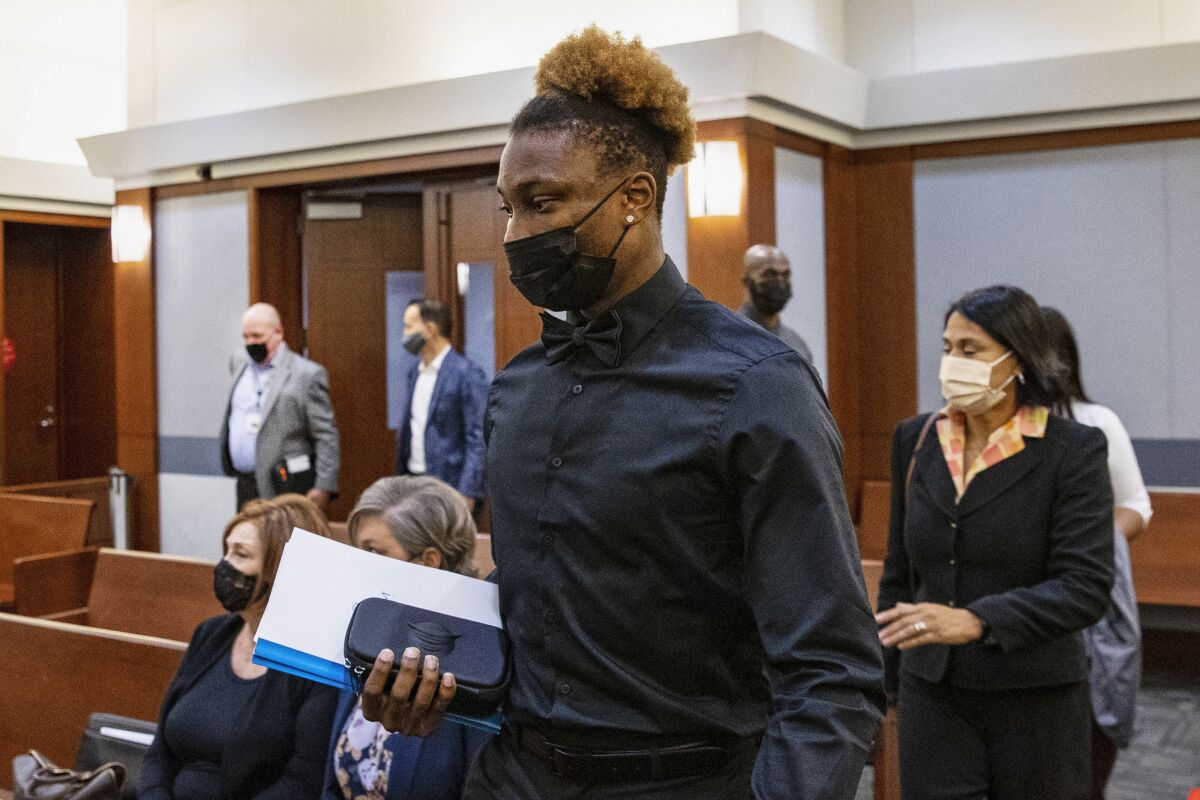 FILE - Former Las Vegas Raiders wide receiver Henry Ruggs arrives in court during his hearing at the Regional Justice Center in Las Vegas on Nov. 22, 2021. A Las Vegas judge agreed, Thursday, March 10, 2022, to postpone hearing evidence in the criminal case accusing Ruggs of driving drunk and causing a high-speed crash that killed a woman last November. (Bizuayehu Tesfaye/Las Vegas Review-Journal via AP, Pool, File)