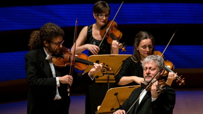 Violinist Fabio Biondi (far right) and his early music ensemble Europa Galante perform works by Vivaldi at the Walt Disney Concert Hall on Tuesday night.