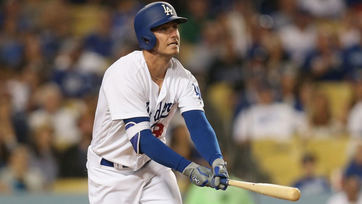 Dodgers' Cody Bellinger watches the first of his two home runs Saturday against Philadelphia.