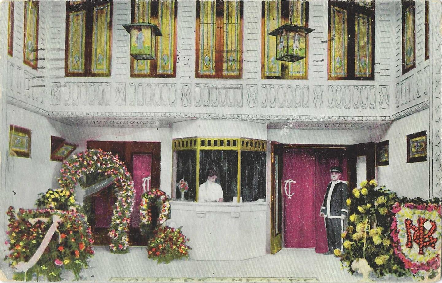 Vintage postcard shows the entrance to the College Theater, bedecked with flowers and red curtains, with a uniformed doorman.