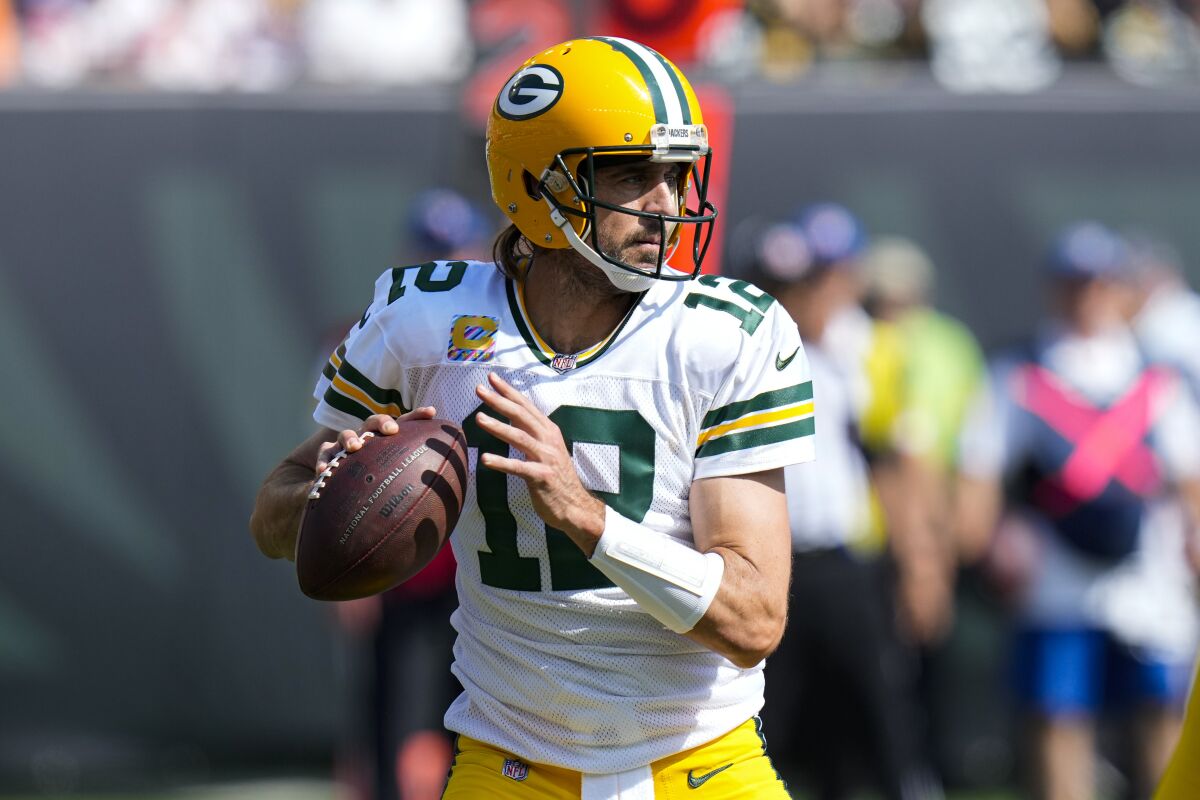 Green Bay Packers quarterback Aaron Rodgers (12) throws against the Cincinnati Bengals in the first half of an NFL football game in Cincinnati, Sunday, Oct. 10, 2021. (AP Photo/AJ Mast)